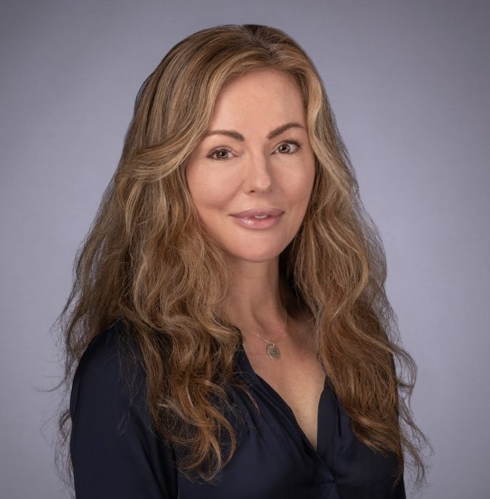 Ophthalmologist Doctor Vivian Hill posing wearing a blue shirt