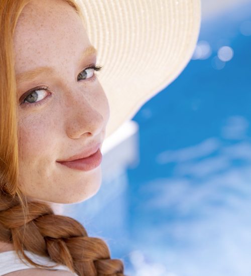 close-up-smiley-woman-by-pool close-up-smiley-woman-by-pool